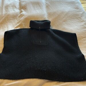 Black sweater vest with a zipper